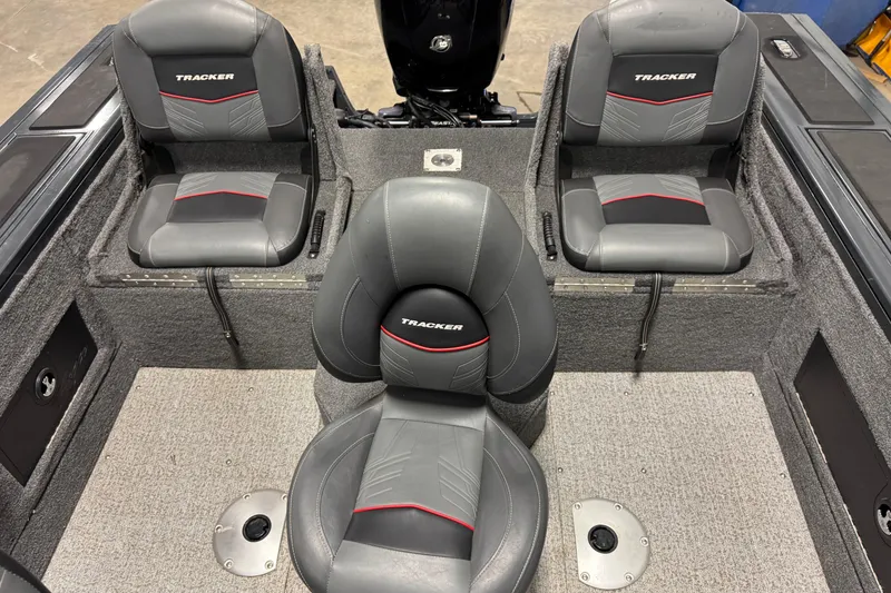 Slide: The Image of 2022 Tracker Targa V-18 WT boat interior with three gray seats. - 7