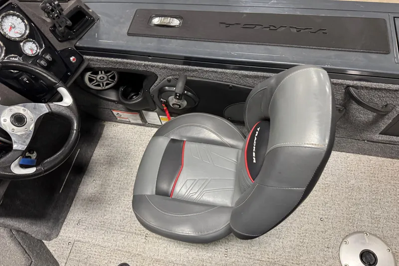 Slide: The Image of 2022 Tracker Targa V-18 WT boat interior with steering wheel and seat. - 8