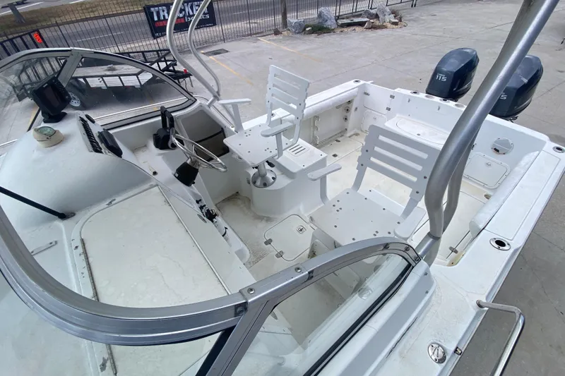 Slide: The Image of 2006 Polar 2300 Walkaround boat interior with dual seats and steering console. - 11