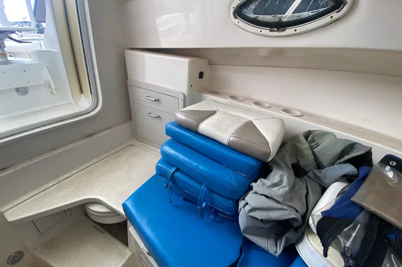 Slide: The Image of Interior of 2006 Polar 2300 Walkaround boat with cushions and storage. - 20