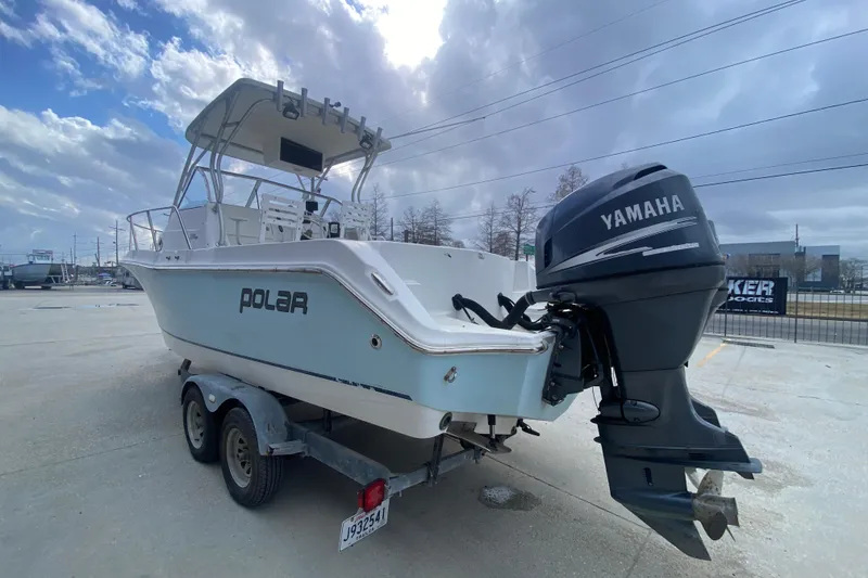 Slide: The Image of 2006 Polar 2300 Walkaround boat with Yamaha outboard motor on trailer. - 5