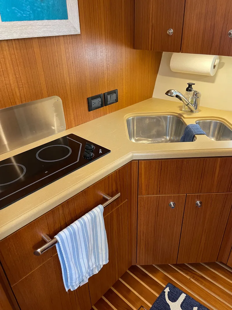 Slide: The Image of Dashboard of a 2004 Tiara Yachts 42 Open with gauges and radio. - 19