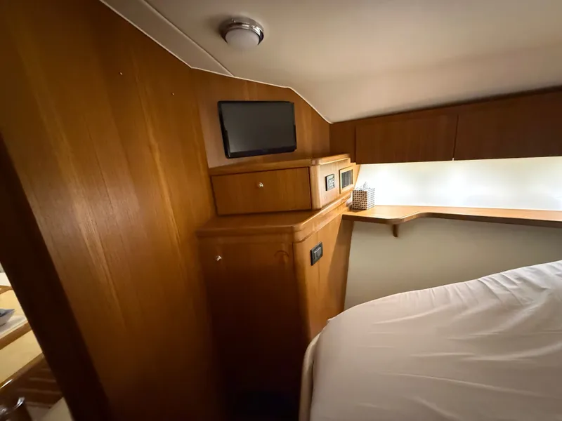 Slide: The Image of Interior of 2004 Tiara Yachts 42 Open with wooden furnishings. - 32