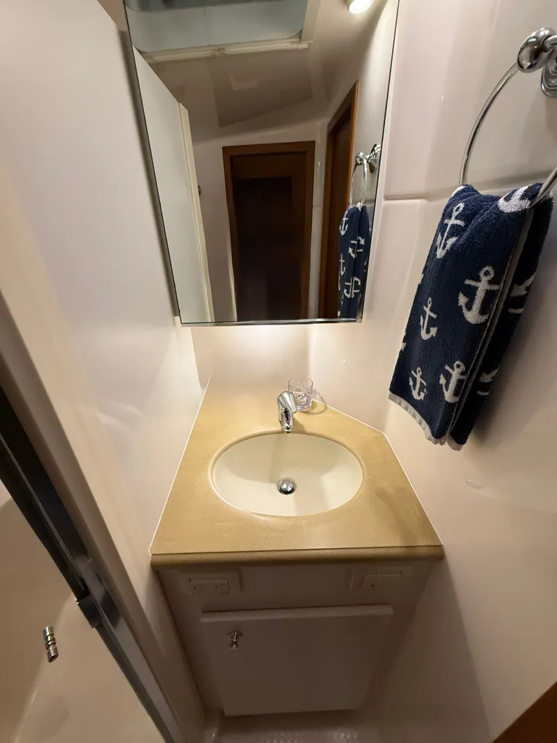Slide: The Image of Bathroom in 2004 Tiara Yachts 42 Open with anchor towel. - 35