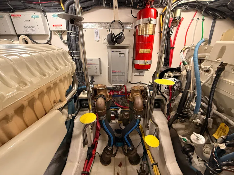 Slide: The Image of Engine room of 2004 Tiara Yachts 42 Open with wiring and fire extinguisher. - 40