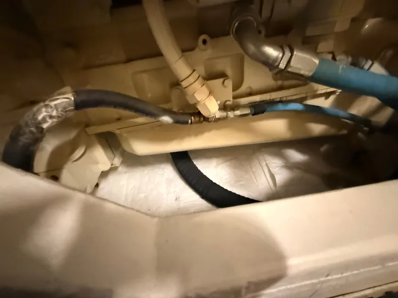 Slide: The Image of Engine compartment of 2004 Tiara Yachts 42 Open with hoses. - 41
