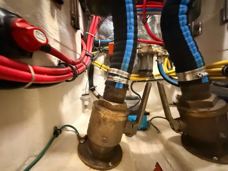 Slide: The Image of Engine room of 2004 Tiara Yachts 42 Open with hoses and valves. - 44