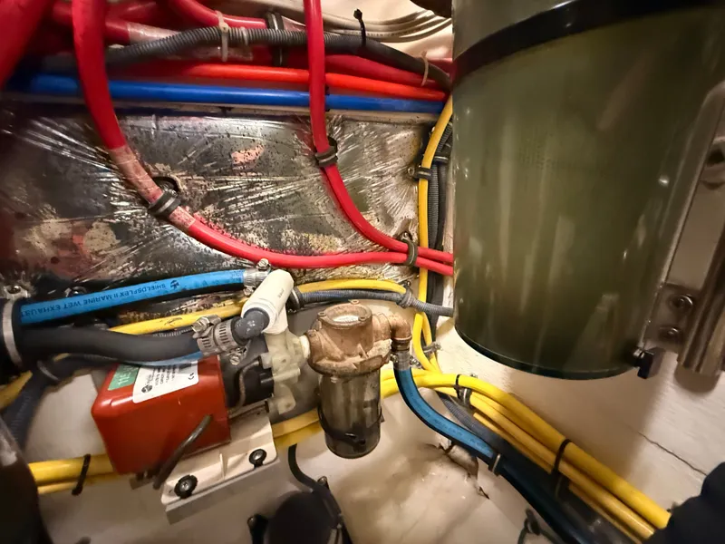 Slide: The Image of Engine room of 2004 Tiara Yachts 42 Open with cables and filters. - 45