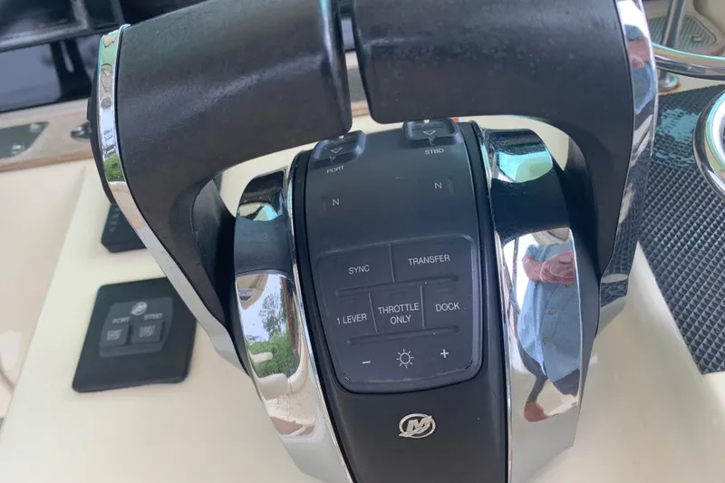 Slide: The Image of Throttle controls of a 2019 Chris-Craft Catalina 27 boat cockpit. - 10