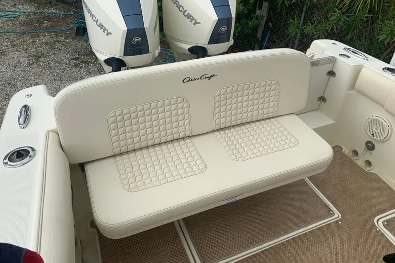 Slide: The Image of 2019 Chris-Craft Catalina 27 boat with beige seating and dual Mercury engines. - 14