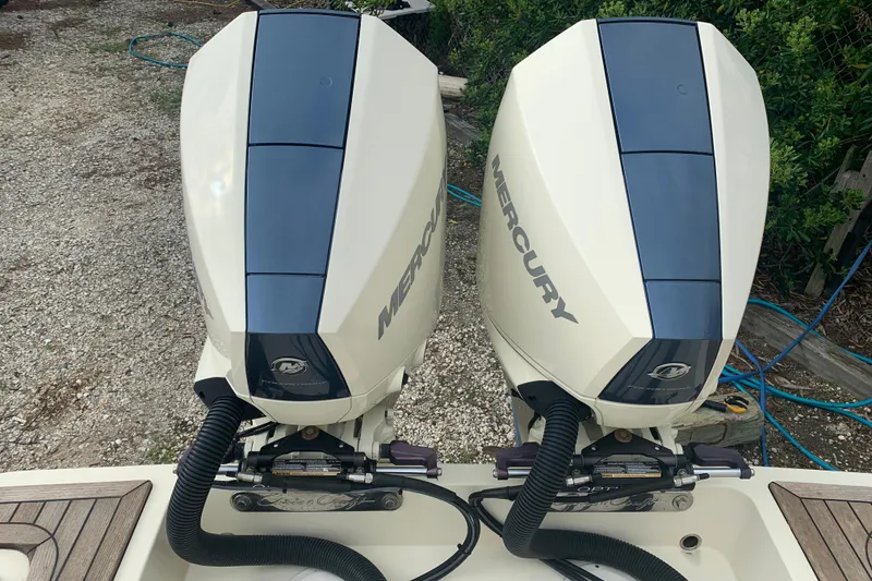 Slide: The Image of Twin Mercury outboard engines on a 2019 Chris-Craft Catalina 27 boat. - 16