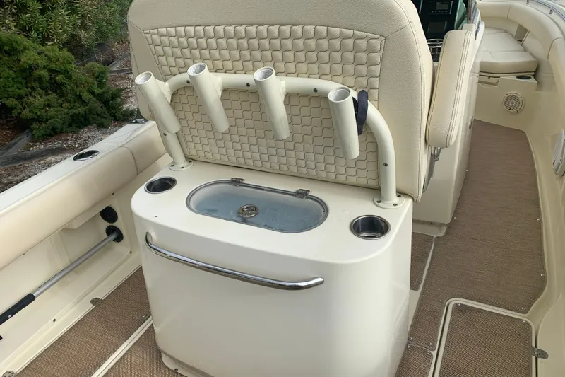 Slide: The Image of 2019 Chris-Craft Catalina 27 boat interior with rod holders and seating. - 17