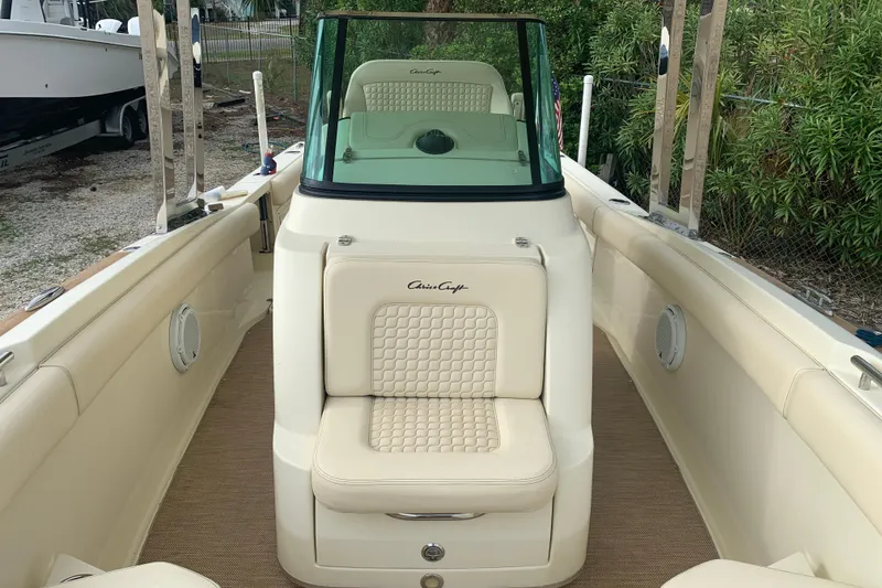 Slide: The Image of 2019 Chris-Craft Catalina 27 boat interior with cream seating and windshield. - 21