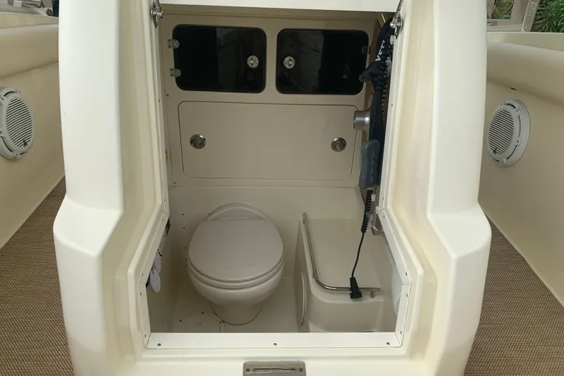 Slide: The Image of 2019 Chris-Craft Catalina 27 boat interior with toilet and storage compartments. - 22