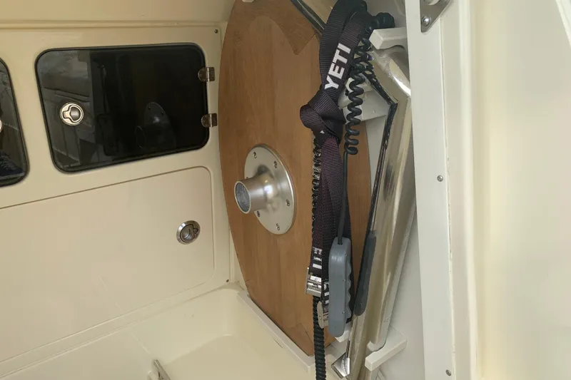 Slide: The Image of Interior of 2019 Chris-Craft Catalina 27 boat with wooden accents and YETI strap. - 23