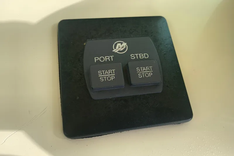 Slide: The Image of Control panel of a 2019 Chris-Craft Catalina 27 boat with start/stop buttons. - 29