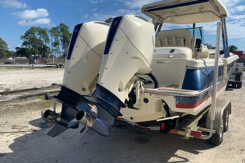Slide: The Image of 2019 Chris-Craft Catalina 27 boat with dual outboard engines on a trailer. - 3