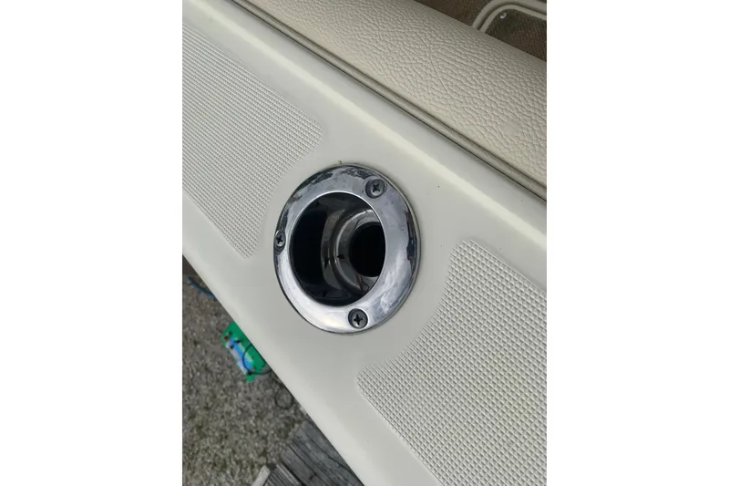 Slide: The Image of 2019 Chris-Craft Catalina 27 boat detail with chrome fitting and textured surface. - 34