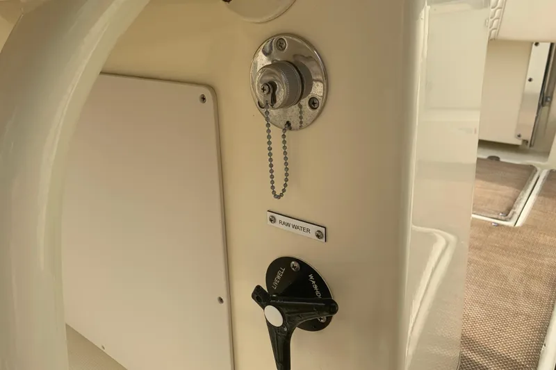 Slide: The Image of 2019 Chris-Craft Catalina 27 raw water control panel with valve and chain. - 39