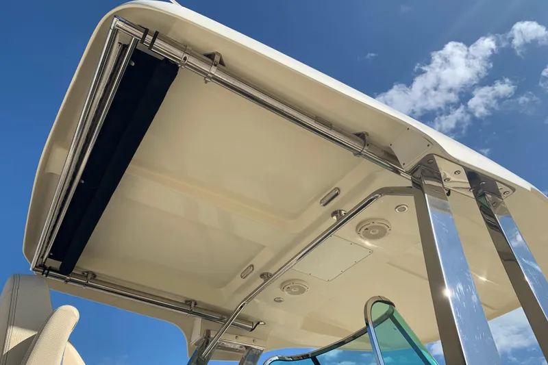 Slide: The Image of 2019 Chris-Craft Catalina 27 boat canopy under blue sky. - 4