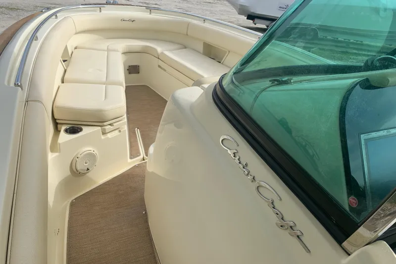 Slide: The Image of 2019 Chris-Craft Catalina 27 boat interior with cushioned seating and sleek design. - 40