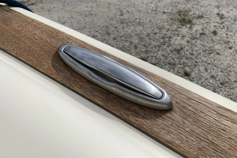 Slide: The Image of 2019 Chris-Craft Catalina 27 boat cleat on wooden deck. - 44