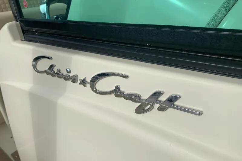 Slide: The Image of 2019 Chris-Craft Catalina 27 boat logo on white surface. - 46