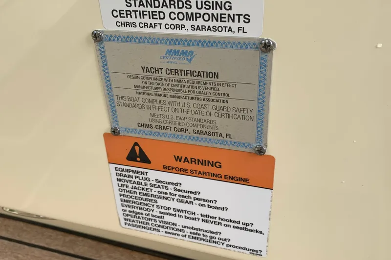 Slide: The Image of 2019 Chris-Craft Catalina 27 yacht certification and safety warning labels. - 49