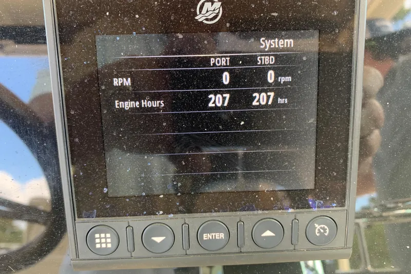 Slide: The Image of Dashboard display of a 2019 Chris-Craft Catalina 27 showing 207 engine hours. - 5