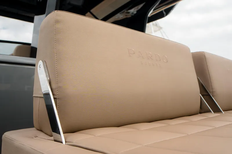 Slide: The Image of 2024 Pardo Yachts P43 luxury seating detail with embossed logo. - 14