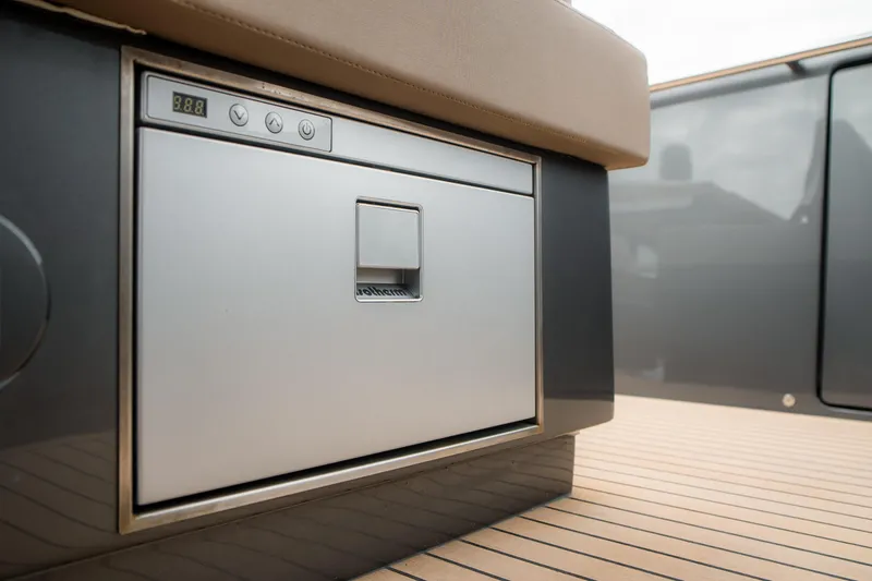 Slide: The Image of 2024 Pardo Yachts P43 interior detail, featuring a sleek built-in appliance on teak flooring. - 18