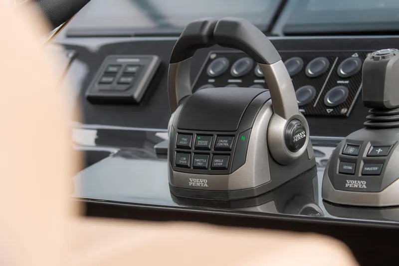 Slide: The Image of Control panel of 2024 Pardo Yachts P43 featuring Volvo Penta throttle and joystick. - 27