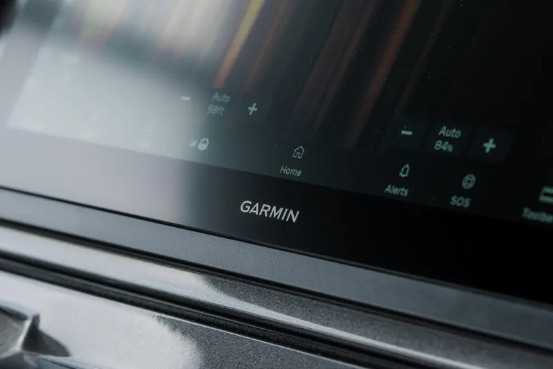 Slide: The Image of Garmin display on 2024 Pardo Yachts P43 dashboard, featuring navigation controls. - 34