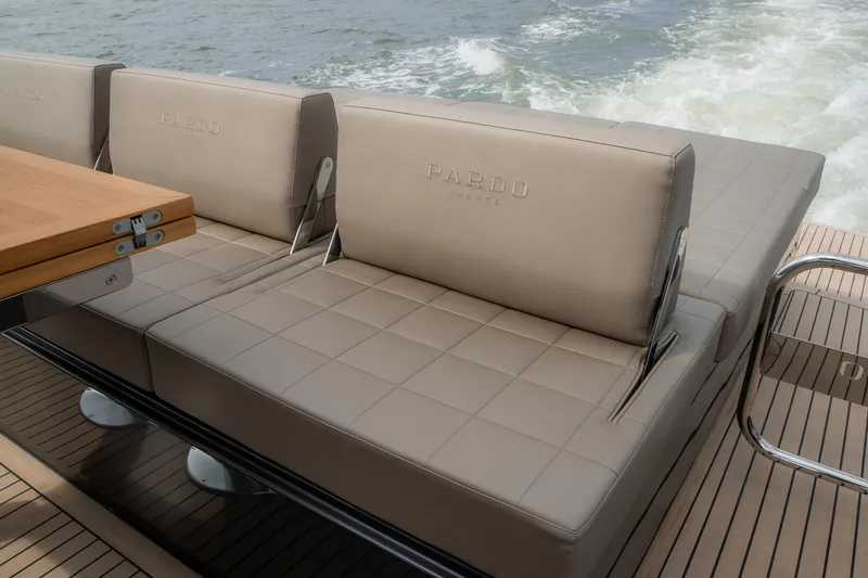 Slide: The Image of 2024 Pardo Yachts P43 luxury seating area with elegant design on open water. - 13