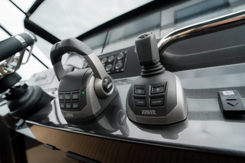Slide: The Image of Control panel of 2024 Pardo Yachts P43 featuring Volvo Penta joystick and throttle. - 26