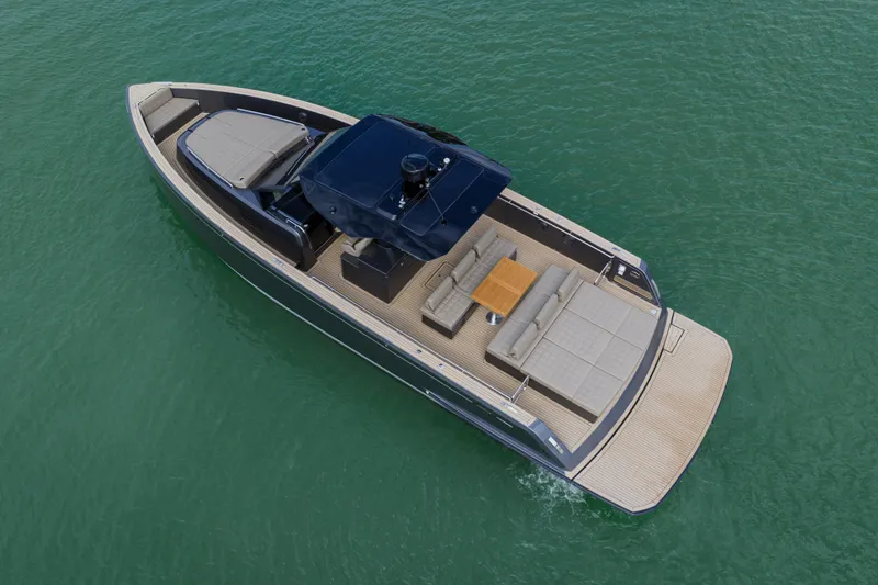 Slide: The Image of 2024 Pardo Yachts P43 luxury yacht cruising on clear blue water. - 6