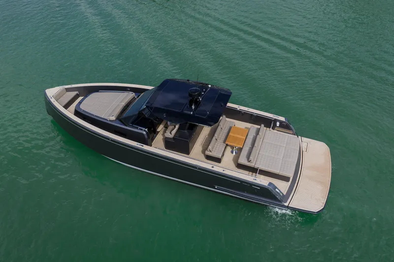 Slide: The Image of 2024 Pardo Yachts P43 luxury yacht cruising on clear green water. - 7