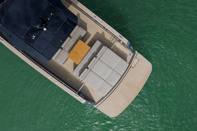 Slide: The Image of Aerial view of 2024 Pardo Yachts P43 luxury yacht on green water. - 8