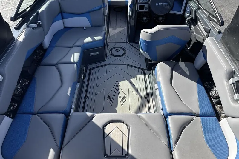 Slide: The Image of 2019 Supra SR boat interior with blue and gray seating, modern design. - 10