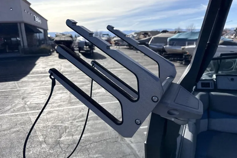 Slide: The Image of 2019 Supra SR boat with a wakeboard rack in a marina setting. - 22