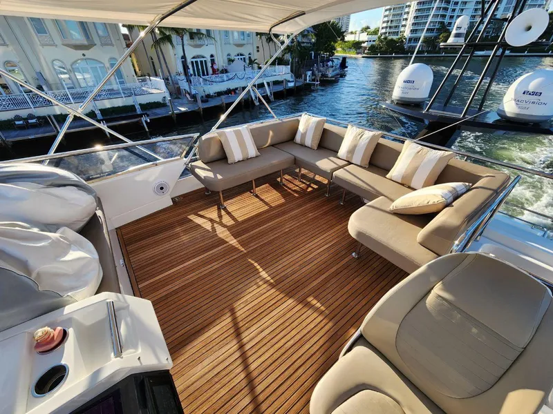 Slide: The Image of Luxurious 2019 Azimut 77S yacht with spacious outdoor seating area and waterfront view. - 33
