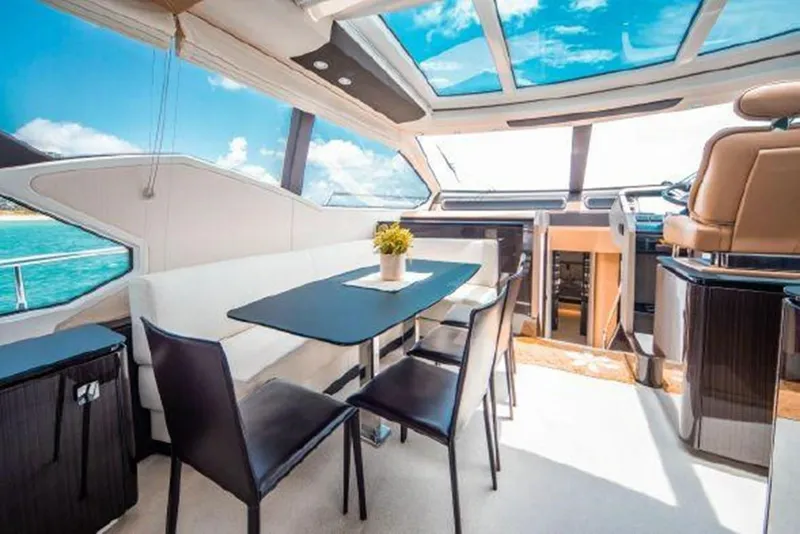 Slide: The Image of Luxurious interior of 2019 Azimut 77S yacht with panoramic windows and modern dining area. - 6