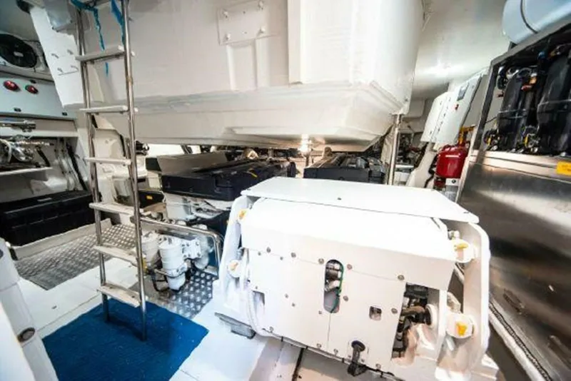 Slide: The Image of Engine room of a 2019 Azimut 77S yacht with visible machinery and ladder. - 35