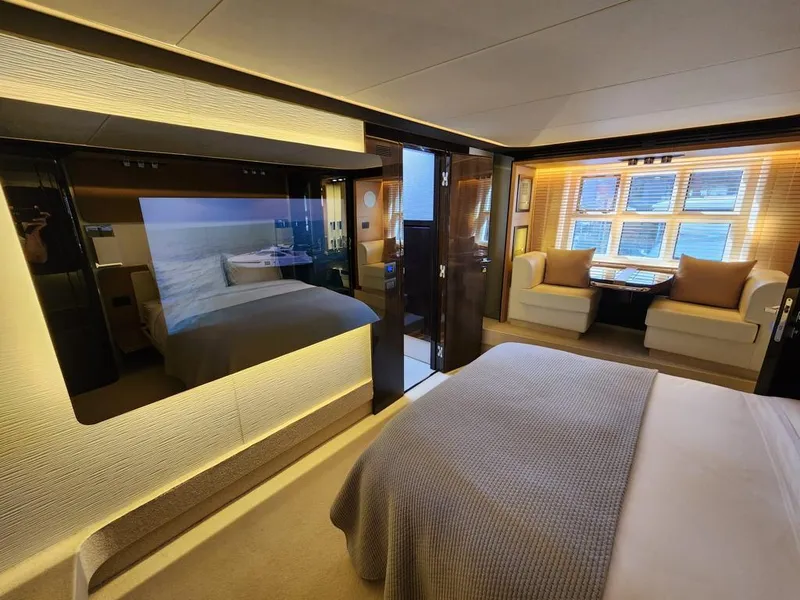 Slide: The Image of Luxurious bedroom interior of 2019 Azimut 77S yacht with modern decor and large windows. - 18