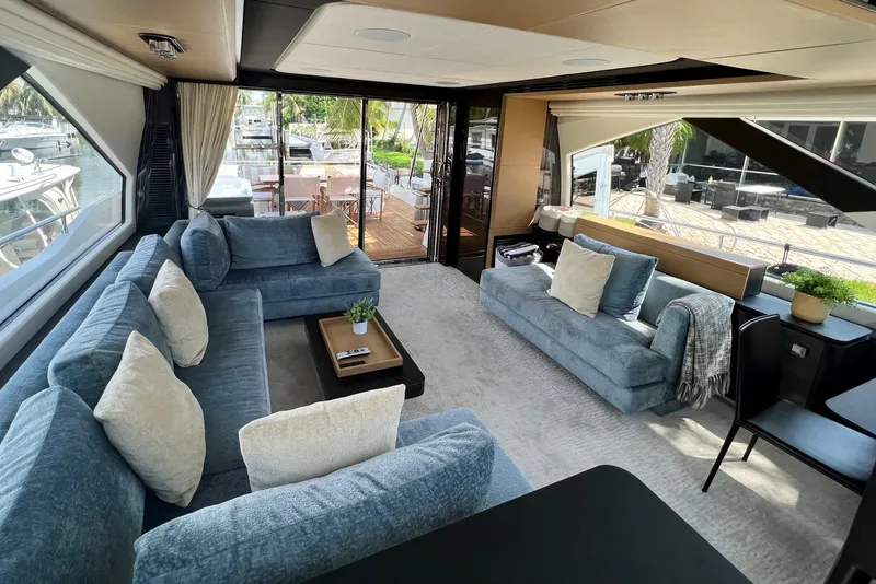 Slide: The Image of Luxurious interior of 2019 Azimut 77S yacht with plush seating and large windows. - 3