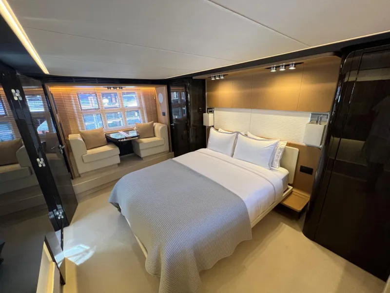 Slide: The Image of Luxurious master bedroom on the 2019 Azimut 77S yacht with modern decor. - 17