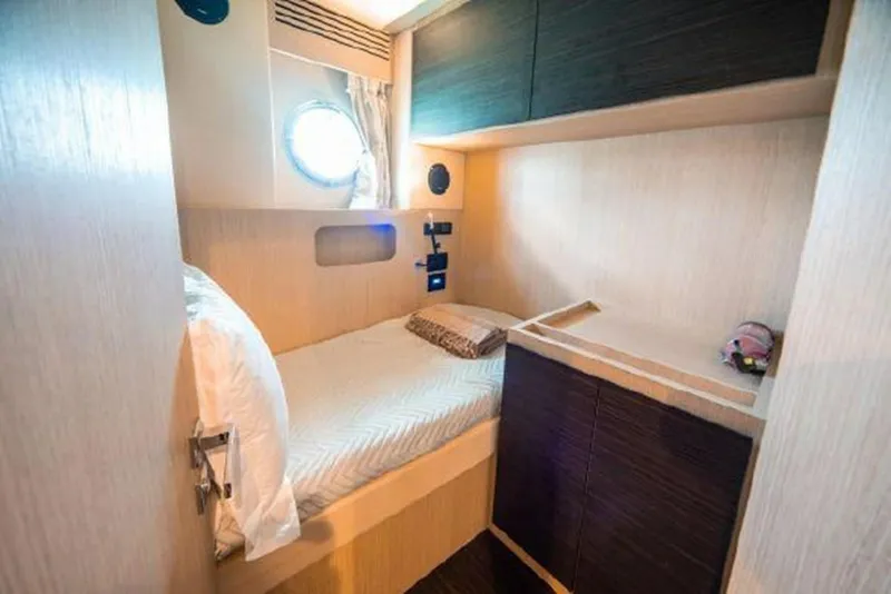 Slide: The Image of Compact cabin interior of 2019 Azimut 77S yacht with bed and storage. - 30