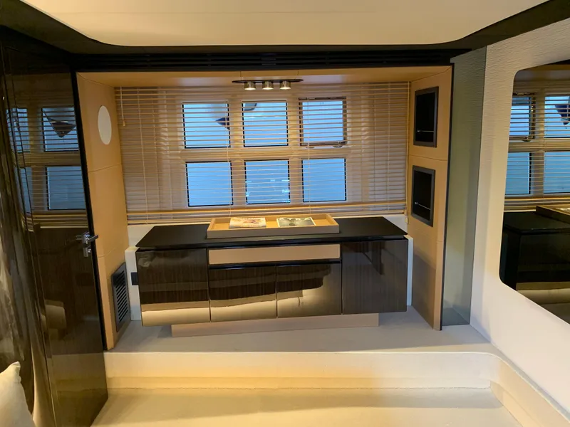 Slide: The Image of Interior of 2019 Azimut 77S yacht with modern cabinetry and window blinds. - 15