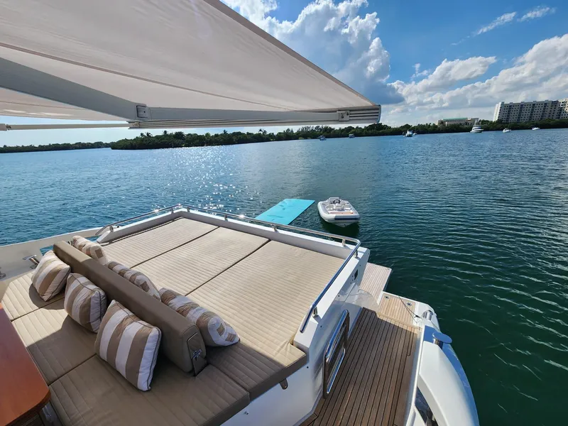 Slide: The Image of Luxury 2019 Azimut 77S yacht with sun deck and scenic water view. - 12