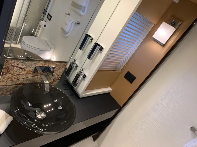 Slide: The Image of Luxurious bathroom in a 2019 Azimut 77S yacht with modern fixtures. - 20